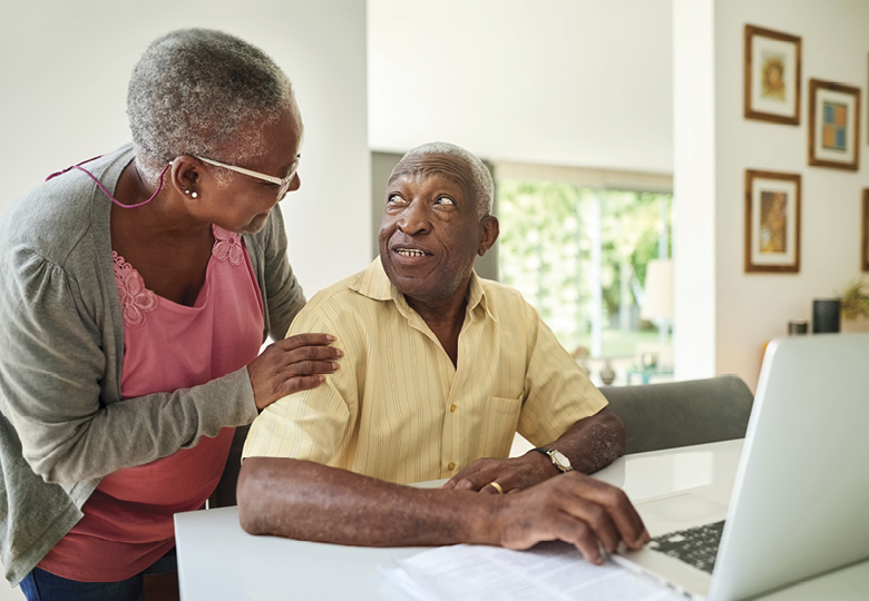 older couple at home on a laptop